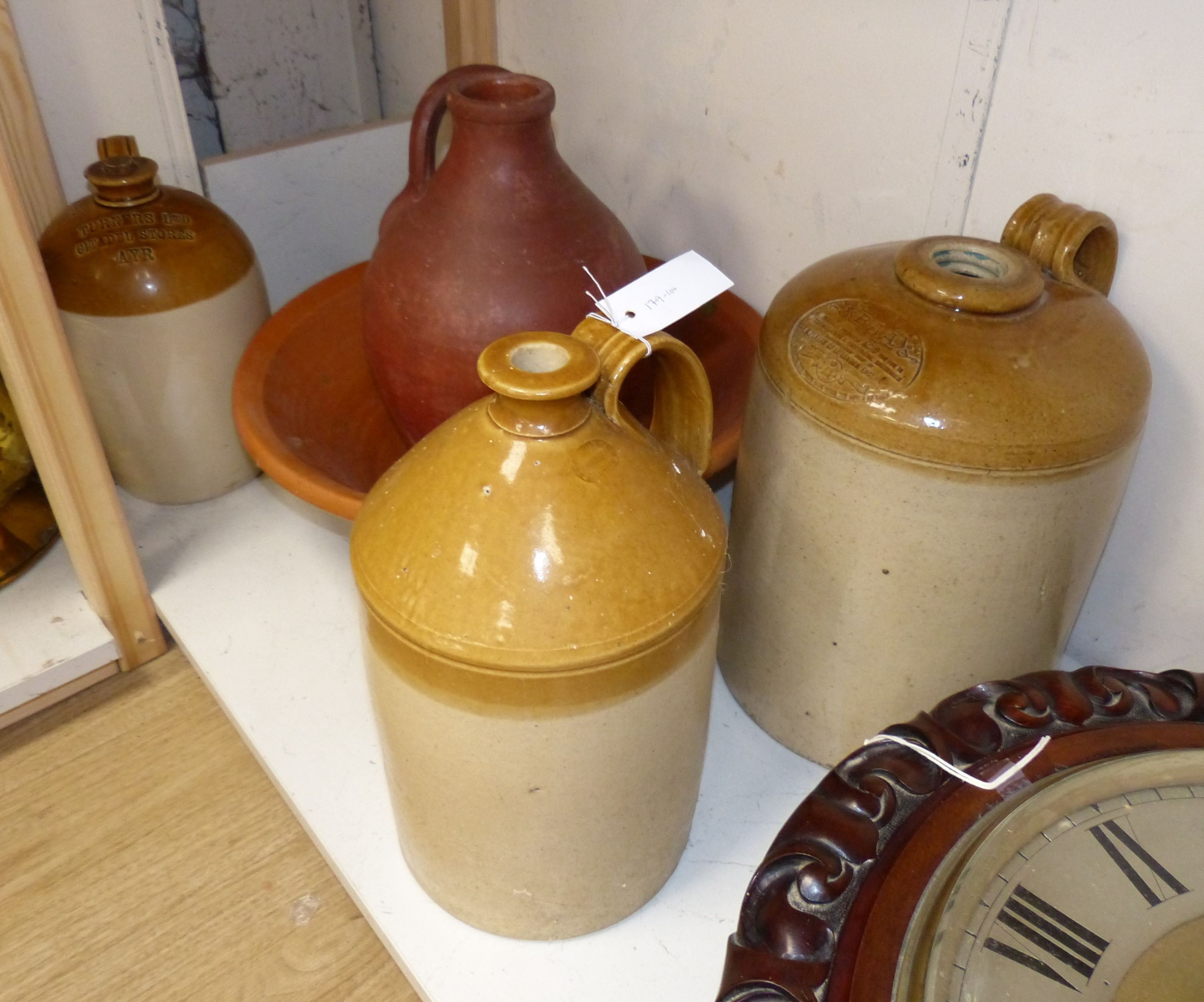 Stoneware flagons and a terracotta dairy bowl